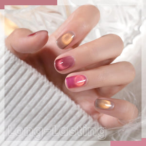 Long-lasting moonlight ceramic cat eye gel polish on short round nails showing gradient colors in hot pink coral nude with high-gloss finish