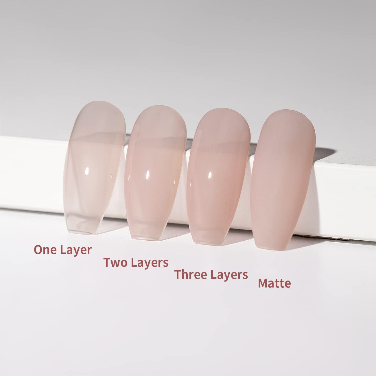 Different layers effect comparison 1 layer 2 layers 3 layers matte finish sheer rose nude buildable opacity on nail tips
