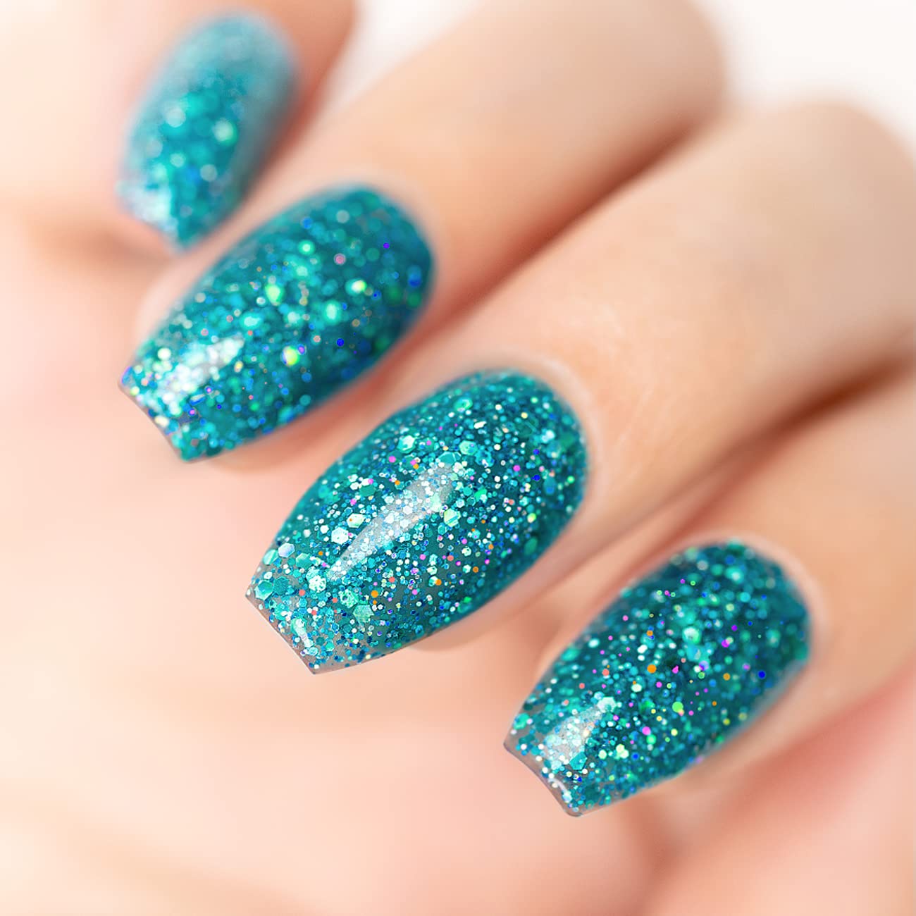 Ocean Sparkle turquoise glitter manicure with pink yellow green holographic iridescent sparkles
