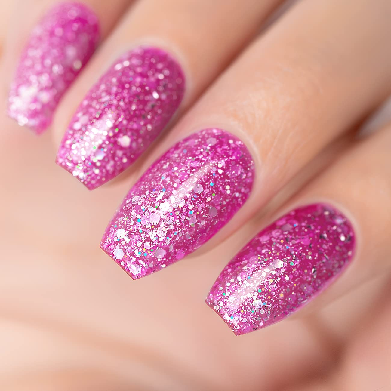 Pink Stardust glitter manicure with iridescent holographic white silver sparkles on nails
