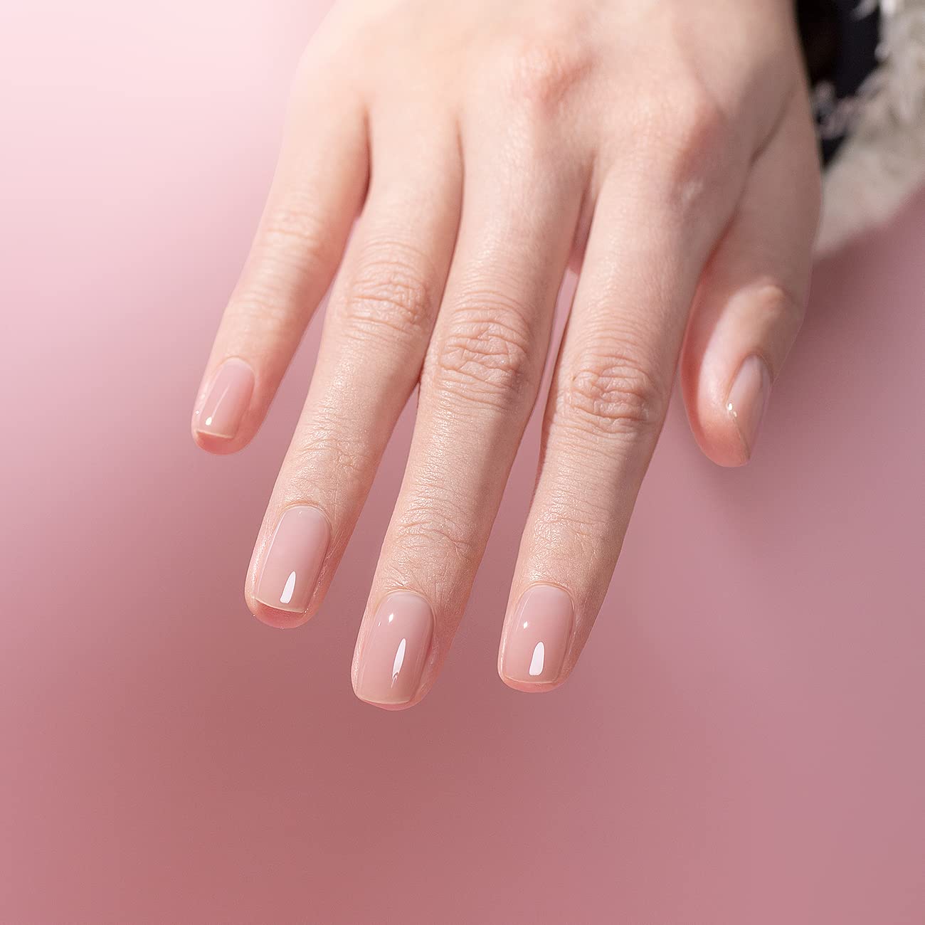 Petal Veil rose nude manicure short nails natural sheer pink finish on hand
